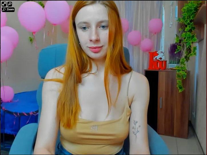 A sexy redhead webcam girl at xlovecam com